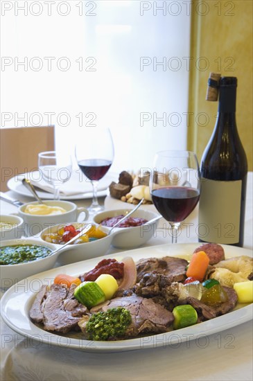 Beef and vegetables dinner with wine