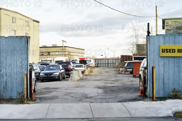 Cars parked in urban lot