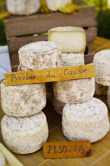 Wheels of cheese for sale in market