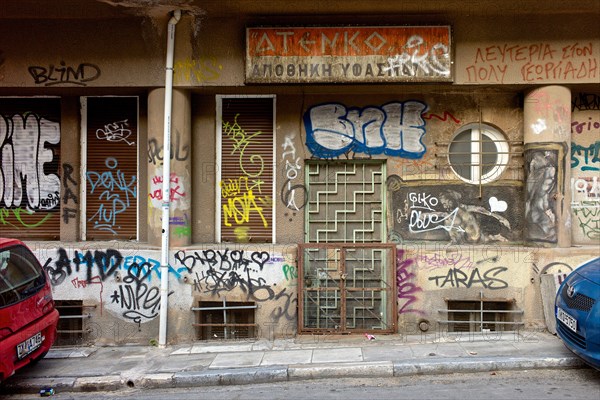 Graffiti covering urban wall in city