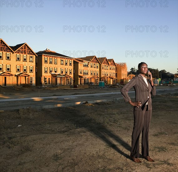 African American businesswoman at residential construction site