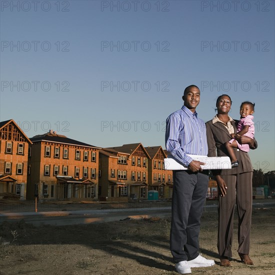 African American family at residential construction site