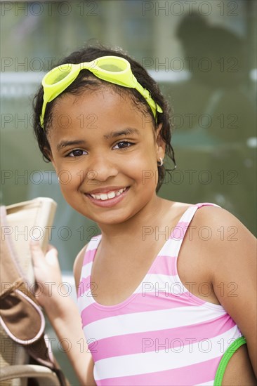 Hispanic girl wearing bathing suit