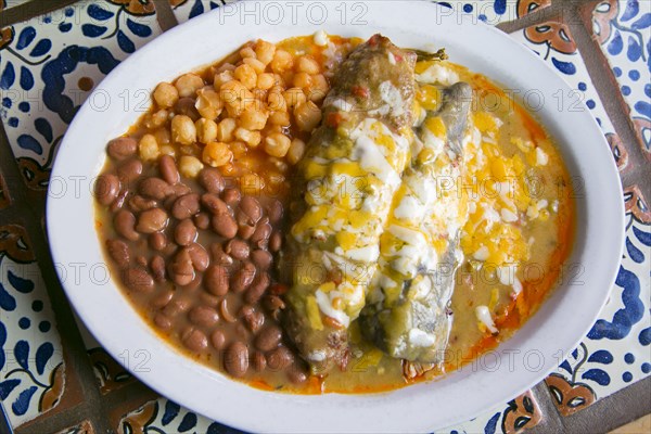 Enchiladas and beans in bowl