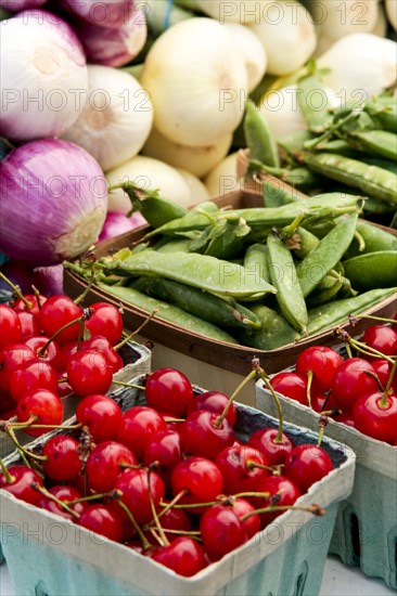 Cartons of fresh vegetables at market