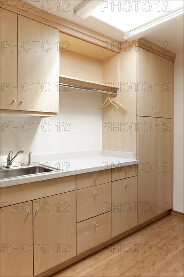 Cabinets and sink in modern room