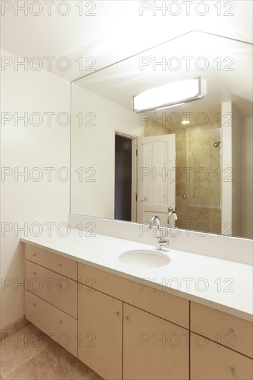 Mirror over sink in modern bathroom