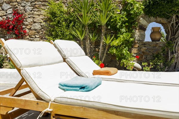 Folded towels on deck chairs