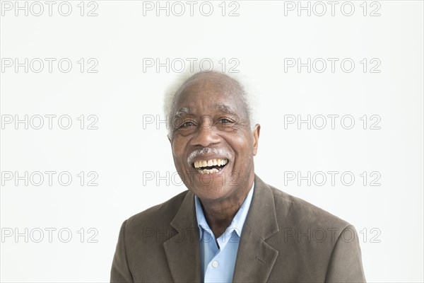 Portrait of laughing older Black man