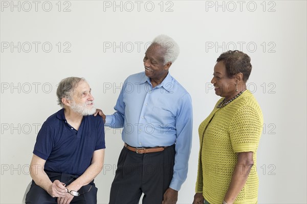 Older couple talking to friend