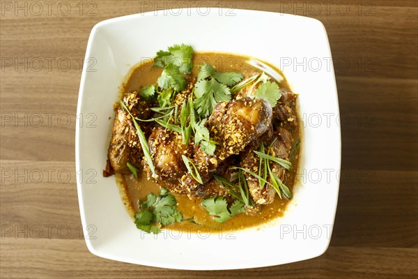 Meat and leaves in bowl