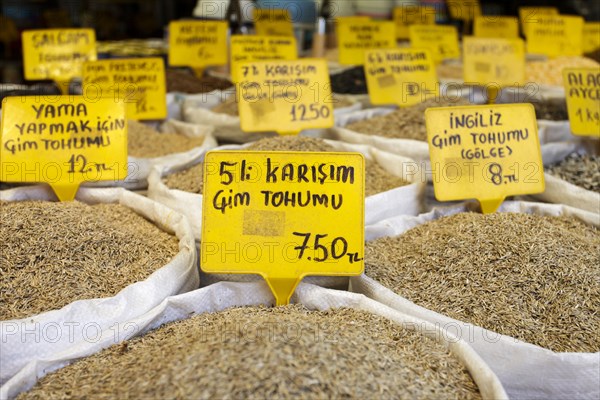 Spices in sacks with prices at market