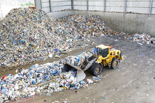 Bulldozer pushing trash