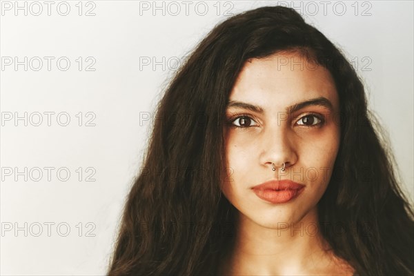 Portrait of mixed race woman with nose ring