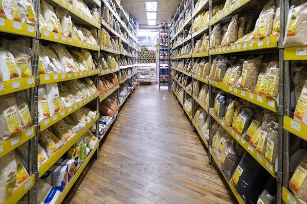 Bags of food in supermarket aisle