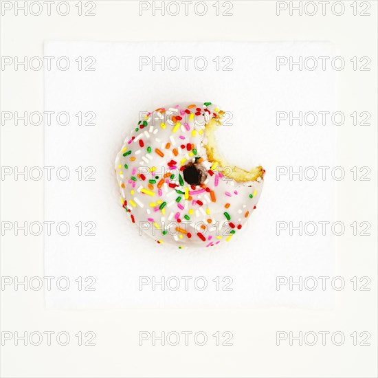 Bite taken out of frosted donut