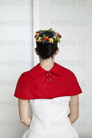 Caucasian woman in fashionable red cape