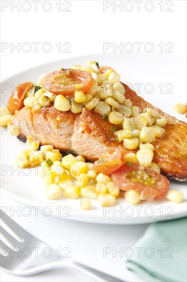Salmon and corn on plate