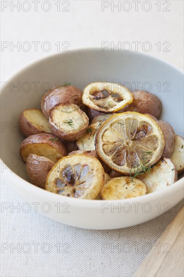 Potatoes and lemon in bowl