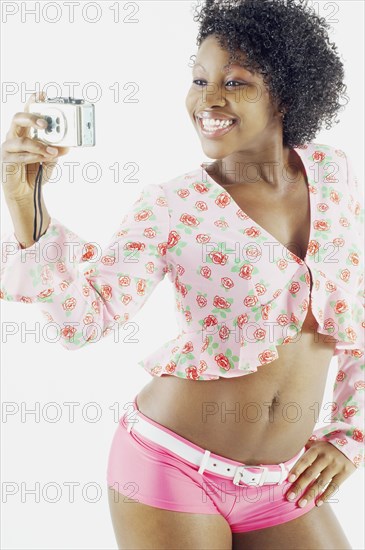 Woman taking self portrait with camera