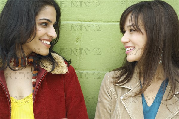 Young women looking at each other