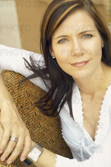 Close up of woman sitting in chair