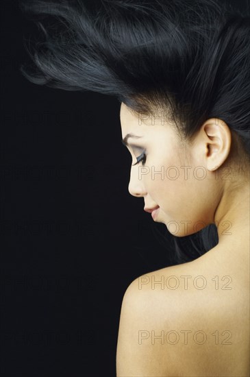 Hispanic woman with hair blowing