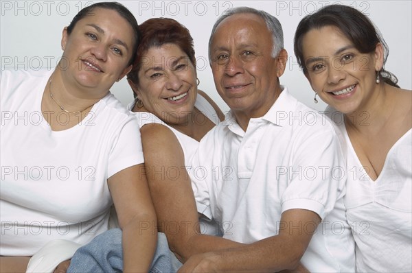 Portrait of Hispanic parents and adult daughters