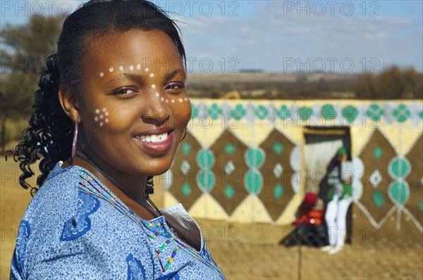 African woman with paint on face