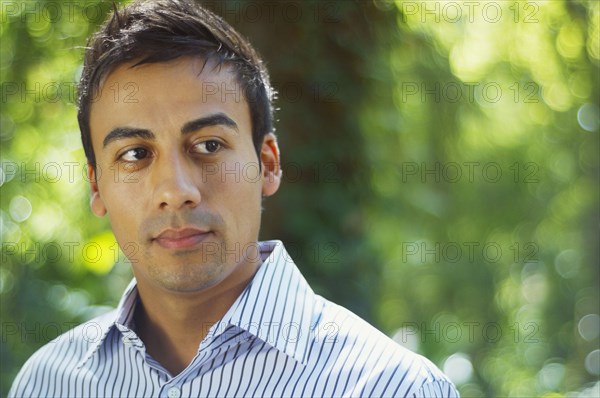 Hispanic man looking pensive