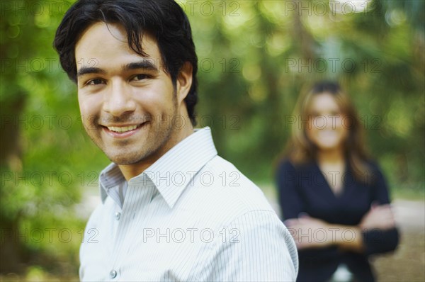 Hispanic businessman posing outdoors