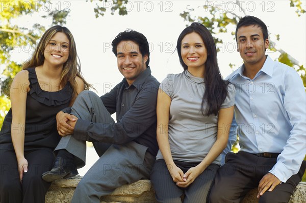 Hispanic business people posing outdoors