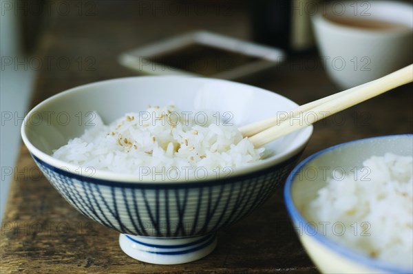 Bowl of rice and chopsticks