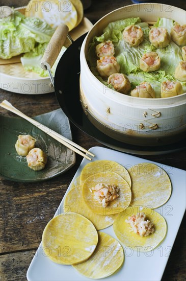 Asian dumpling in steamer with cabbage