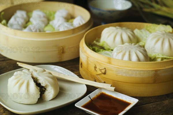 Asian dumpling in steamer with cabbage