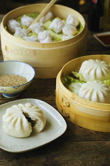 Asian dumpling in steamer with cabbage