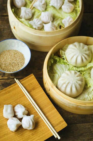 Asian dumpling in steamer with cabbage