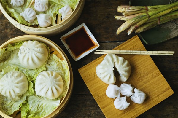 Asian dumpling in steamer with cabbage