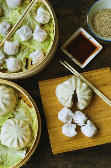 Asian dumpling in steamer with cabbage