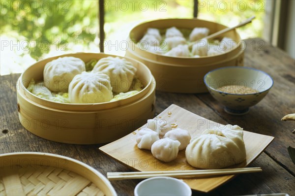 Asian dumpling in steamer with cabbage