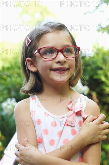 Hispanic girl smiling outdoors