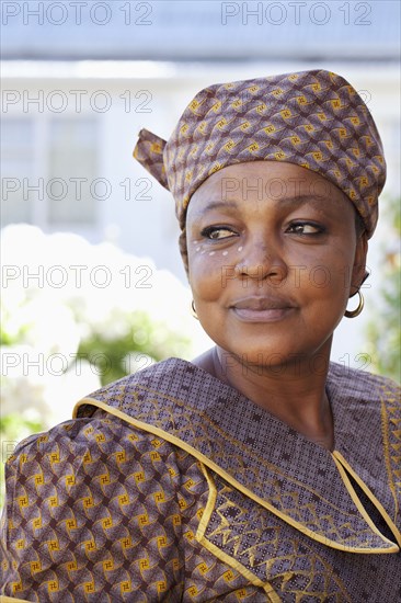 Mixed race woman wearing traditional clothing