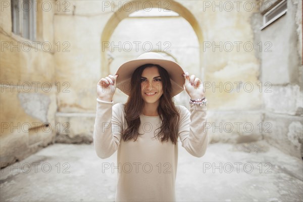 Portrait of smiling Caucasian woman wearing hat
