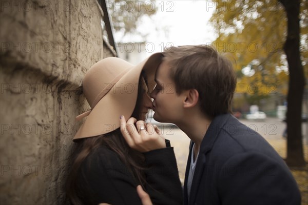 Caucasian man kissing woman on nose