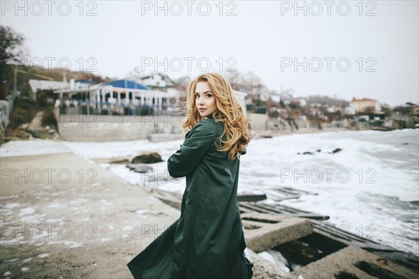 Portrait of serious Caucasian woman on beach