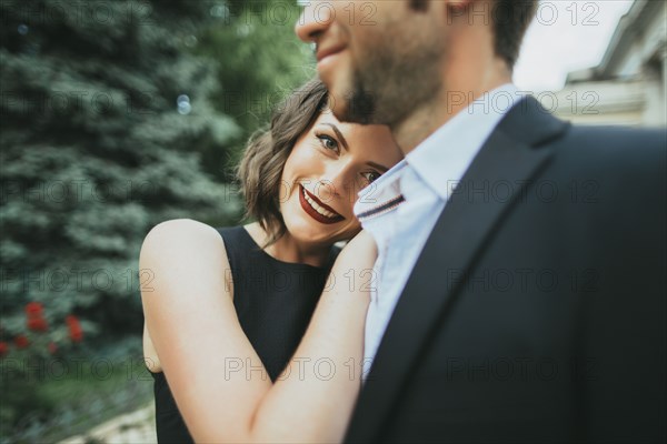 Portrait of smiling Caucasian couple hugging