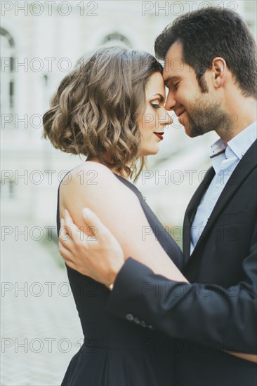 Portrait of smiling Caucasian couple hugging