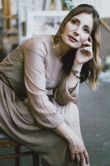 Pensive Caucasian woman sitting on chair