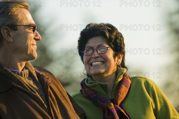 Hispanic couple smiling outdoors
