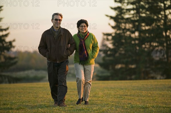 Peruvian couple walking in park